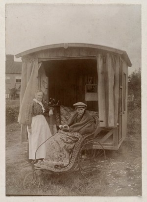 view An invalid boy in a Bath chair outside an open air sleeping-chalet. Photograph by W. Ames, ca. 1900.