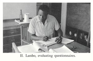 view Photograph of Lambo evaluating questionnaires