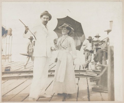 Roger Casement and Mrs French Sheldon. On the back of this photograph is written 'Roger Casement and Mrs French Sheldon - Casement declaring that Germany would take and rule the Congo. Photograph by W.L. Royburgh, 1904'. The letters W.H.M.M, are also stamped onto the front and back of the photograph
