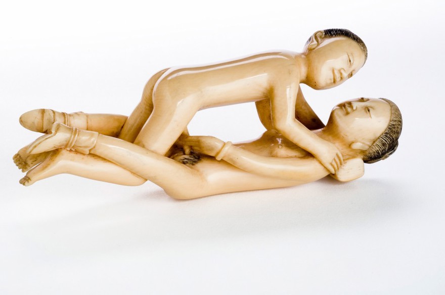 Chinese ivory statue man and woman engaged in sexual foreplay