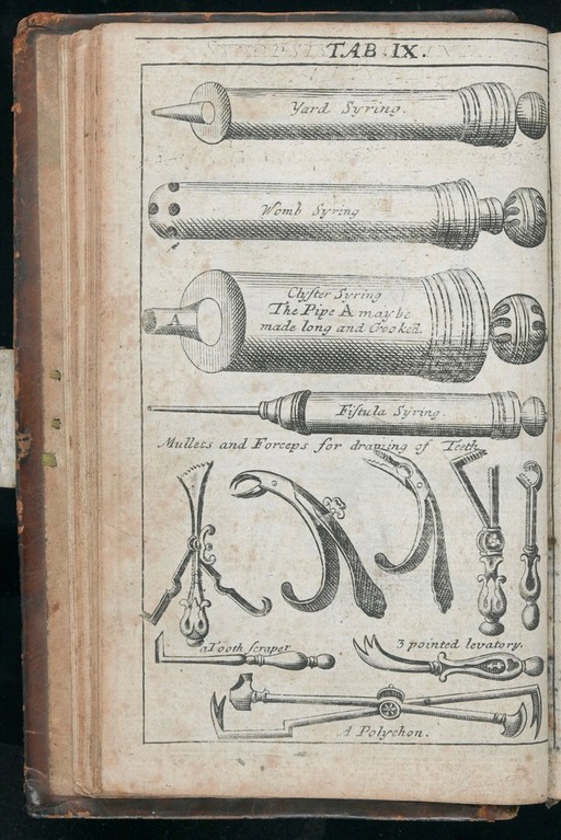 A selection of syringes, forceps & other medical instruments