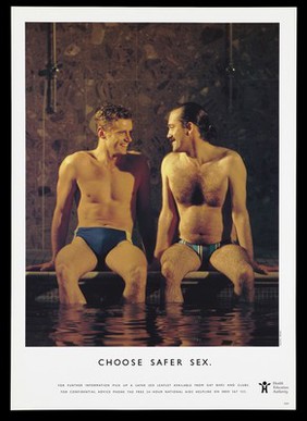 Two men in briefs sit smiling at each other at the edge of a swimming pool; an advertisement for safe sex by the Health Education Authority for the National Aids Helpline. Colour lithograph.