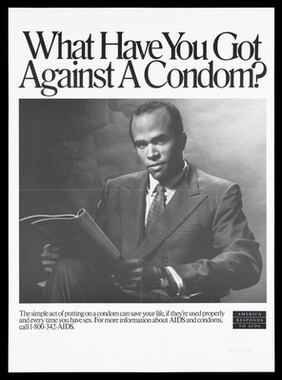 A seated black man wearing a suit and tie with a magazine on his lap; includes the words 'What have you got against a condom?'; advertisement for safe sex to prevent AIDS by the U.S. Department of Health and Human Services. Black and white lithograph.