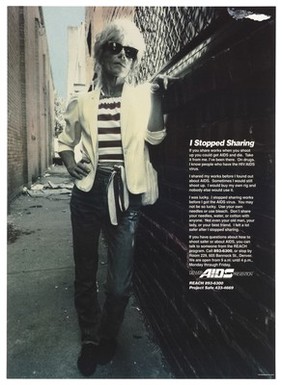 A man in a white jacket, belted striped top and sunglasses leans against a wall in an alleyway with a message about why he stopped sharing needles; part of the Project Safe campaign by Denver AIDS Prevention. Colour lithograph by Daniel Montano's Inc., 1991.