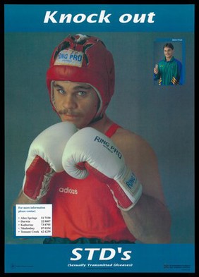 James Swan, a boxer wearing a red Adidas vest and 'Ring Pro Australia' gloves and helmet with an inset photograph of him holding up a condom; an advertisement for information about STDs by the Northern Territory Department of Health and Community Services. Colour lithograph, 1992.