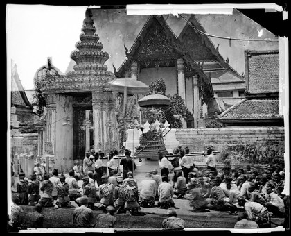 King Mongkut of Siam [Thailand] arriving at the Temple of the Reclining Buddha (Wat Pho) for the ceremony of the Lenten Robes. Photograph by John Thomson, 1865.