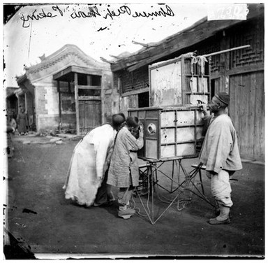 Peking, Pechili province, China: a magic lantern show. Photograph by John Thomson, 1869.