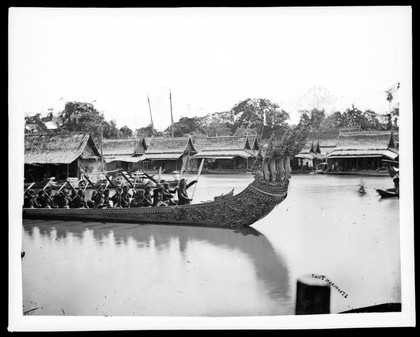 Bangkok, Siam (Thailand): the royal barge on the river for the procession to the Kathin ceremony, 14 October 1865. Photograph by John Thomson, 1865.