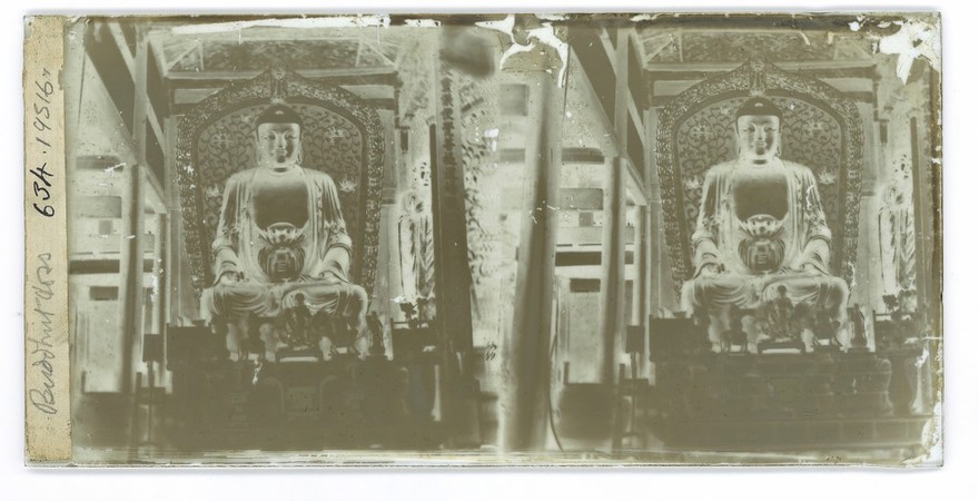 Statue of Buddha in the main hall of Yongquan Monastery, Fuzhou, China. Photograph by John Thomson, 1869.