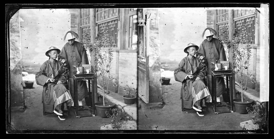 China: a Manchu man with a servant, Beijing. Photograph by John Thomson, 1869.