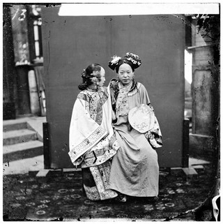 China: a Manchu lady having her face painted, Beijing. Photograph by John Thomson, 1869.