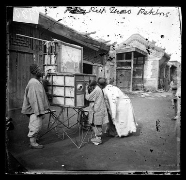 Peking, Pechili province, China: a magic lantern show. Photograph by John Thomson, 1869.