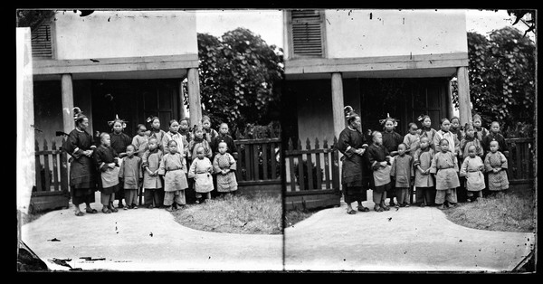 Fukien province, China: women and children outside a school (?). Photograph by John Thomson, 1871.