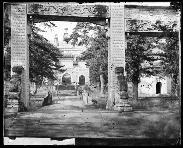 Biyunsi (Temple of Azure Clouds), Beijing: the Jingangta (Diamond Sutra Pagoda), viewed through a memorial arch. Photograph by John Thomson, 1871.
