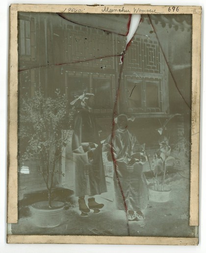China: a Manchu lady with her daughter in-law, Beijing. Photograph by John Thomson, 1869.