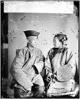 Amoy (Xiamen), Fujian province, China: a husband and wife. Photograph by John Thomson, 1870-1871.