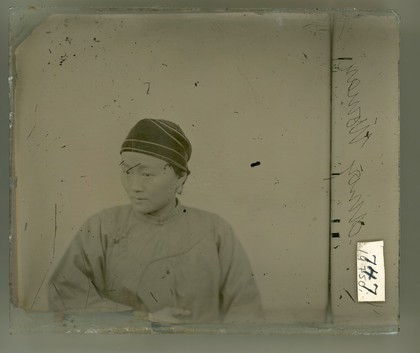 Shanghai, China: a woman wearing a velvet snood. Photograph by John Thomson, 1869.