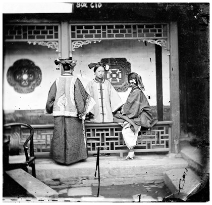 China: three Manchu ladies inside a courtyard, Beijing. Photograph by John Thomson, 1869.