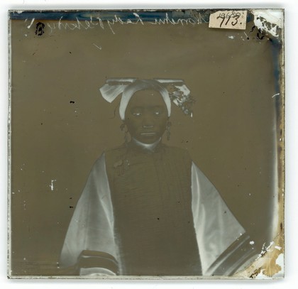 Peking, Pechili province, China: a Manchu lady wearing a coiffure. Photograph by John Thomson, 1869.