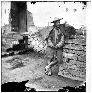 Canton, Kwangtung (Guangdong) province, China: a boatman. Photograph by John Thomson, 1869.