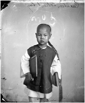 Canton (Guangzhou), Kwangtung province, China: a schoolboy. Photograph by John Thomson, 1869.