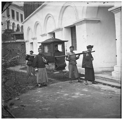 a sedan chair. Photograph by John Thomson