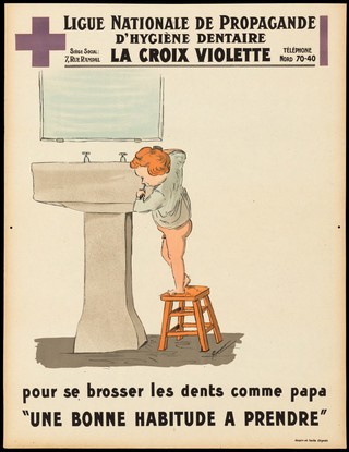 A little boy standing on a stool to brush his teeth at the basin, to emulate his father. Colour lithograph, 1932/1934.