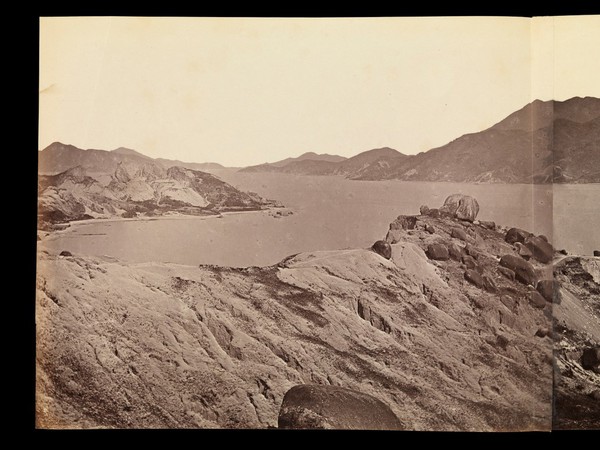 Kowloon, Hong Kong: military encampments on land and fleets in the bay during the Second China War: panoramic view. Photograph by F. Beato, ca. 1860.