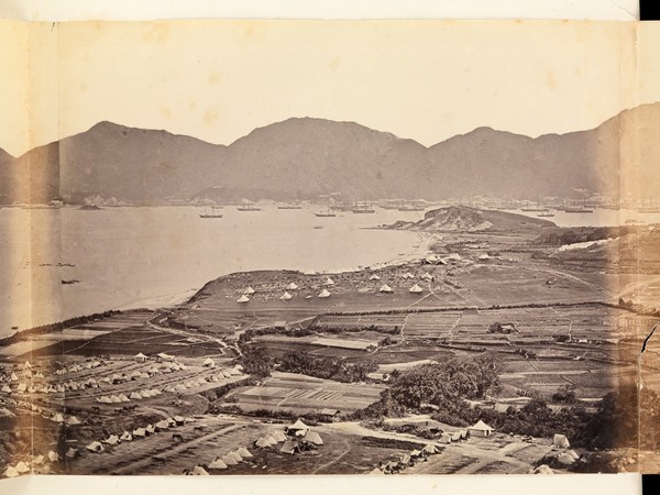 Kowloon, Hong Kong: military encampments on land and fleets in the bay during the Second China War: panoramic view. Photograph by F. Beato, ca. 1860.