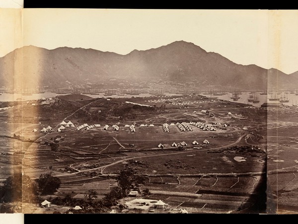 Kowloon, Hong Kong: military encampments on land and fleets in the bay during the Second China War: panoramic view. Photograph by F. Beato, ca. 1860.