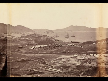 Kowloon, Hong Kong: military encampments on land and fleets in the bay during the Second China War: panoramic view. Photograph by F. Beato, ca. 1860.