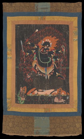 Yama, Buddhist god of death, with the head of a buffalo bedecked with skulls and flames, stands on a bull crushing a man lying on his back. Distemper painting.