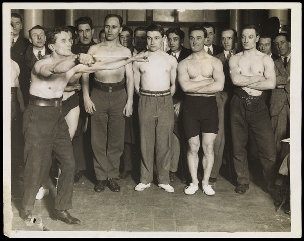 Contestants in a chest-expanding contest in London. Photograph, 1929.