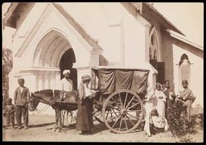 view South India: a cart drawn by a donkey bringing women patients to a medical mission. Photograph by A.R. Slater, 19--.