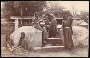 view Hassan, Karnataka, India: young women fetching water from a well at an orphanage. Photograph.