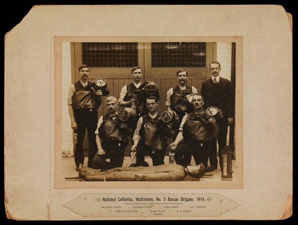 Wattstown, Wales: a rescue brigade of the coal mine, with breathing equipment and a training dummy. Photograph by A. Davies, 1914.
