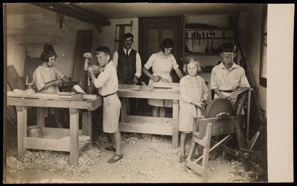 Switzerland: children at a woodwork class with their teacher. Photograph attributed to H. Schlegel, ca. 1925 (?).