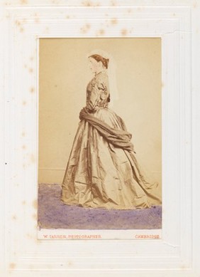 A man in drag posing side-on. Photograph, 189-.