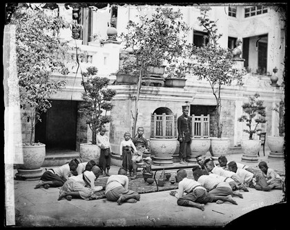 Prince Chulalongkorn of Siam [Thailand] (seated, centre), with Prince Bhanugrangsi Savanwongse (standing next to him) and Prince Kasemsan Sophak (standing, right). Photograph by John Thomson, 1866.