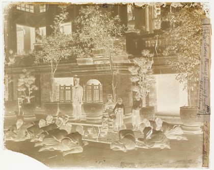 Prince Chulalongkorn of Siam [Thailand] (seated, centre), with Prince Bhanugrangsi Savanwongse (standing next to him) and Prince Kasemsan Sophak (standing, right). Photograph by John Thomson, 1866.