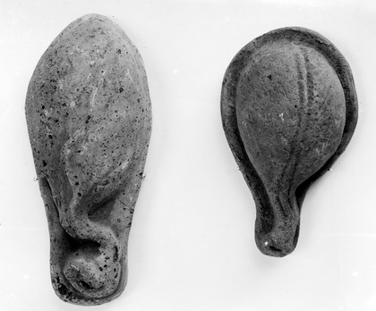 Votives: two pear shaped, stone, cast.