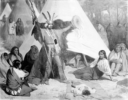 An American Indian medicine man attending a sick child