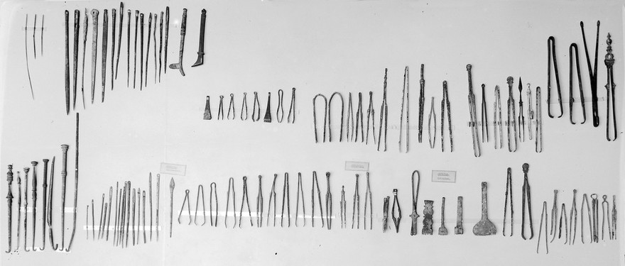 Greco-Roman instruments. Replicas of instruments found at Silchester, Kolophon from the Wellcome Historical Medical Museum