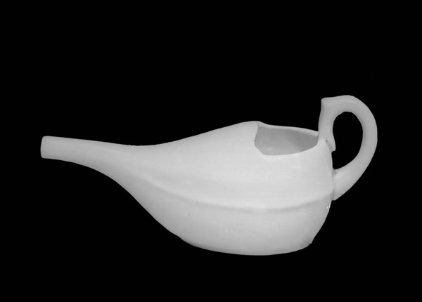 A feeding bottle made of white china, English.