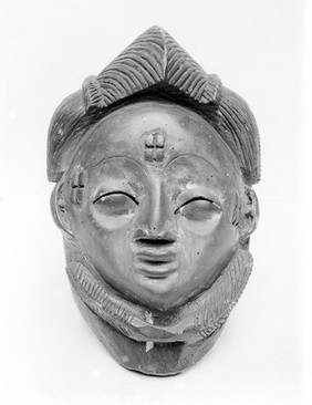 Carved head of wood, Belgian Congo. Religious mask