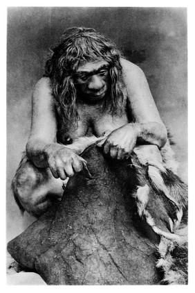 Restoration of a Neanderthal woman cleaning a reindeer skin.