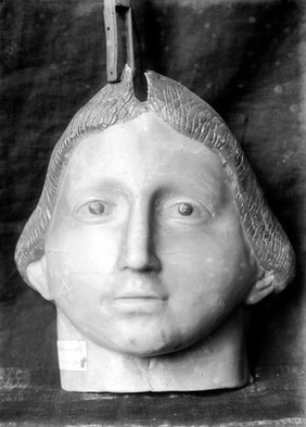Wax ex-voto. Full face, head, very broad features. Musee Etnographique, Palermo.