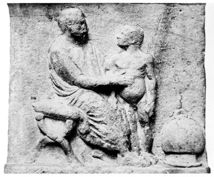 Carved stone relief of Greek physician and patient