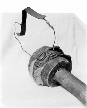 Faraday's first sparking coil, close up of head, back view.