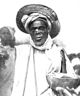 Nigerian native charm seller with scorpion on his nose